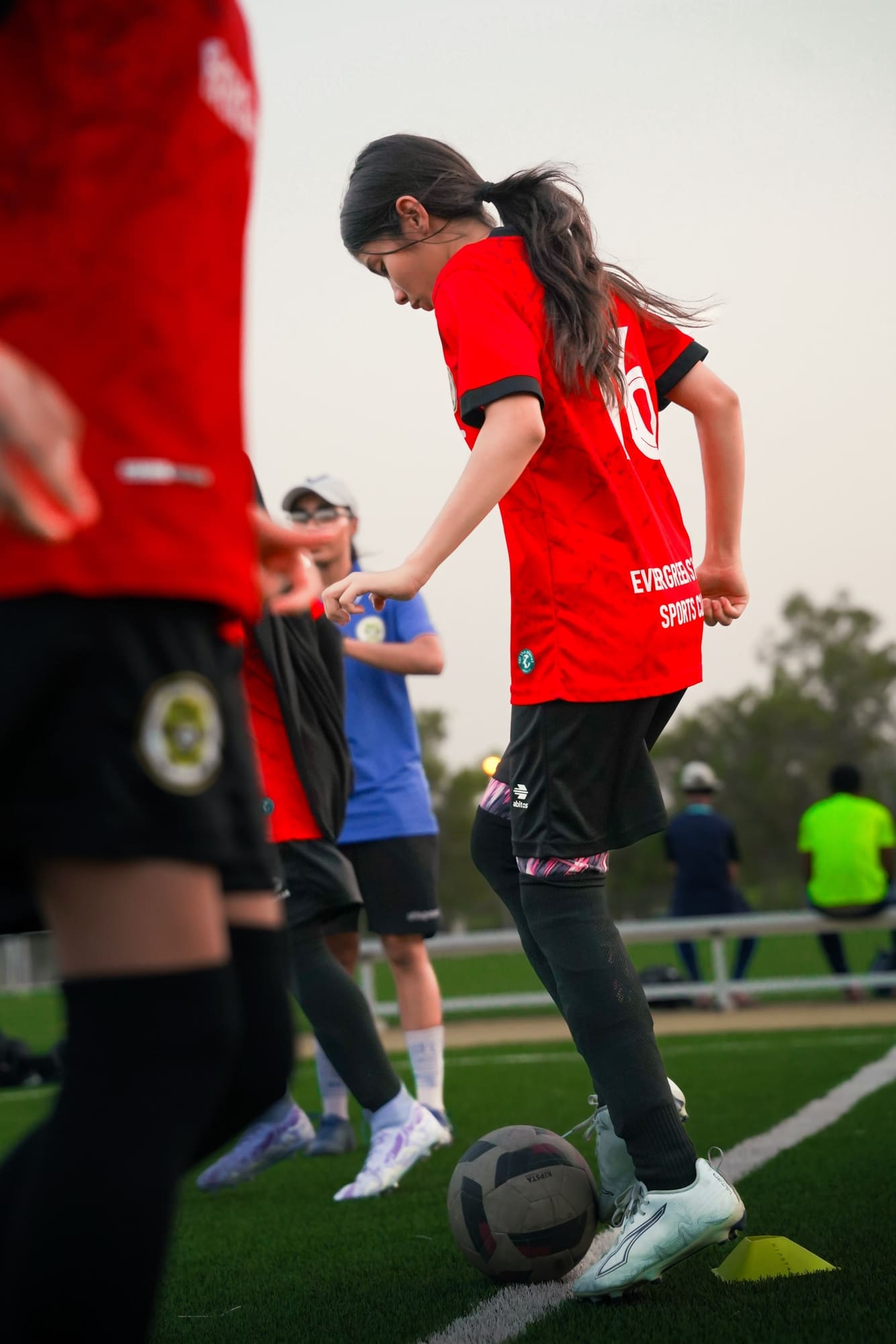 Player taking a first touch during a drill